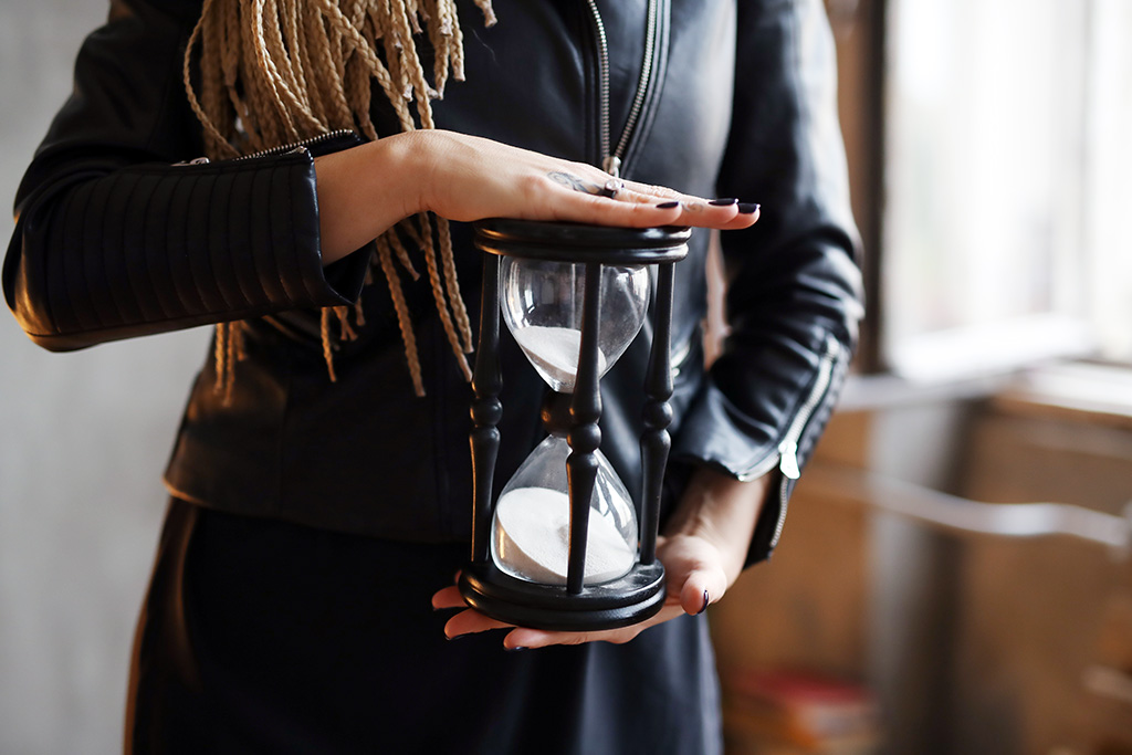 Woman with sand clock